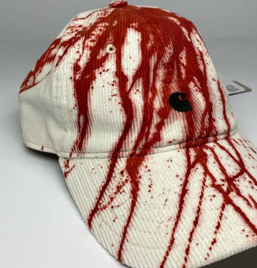 red dye stained white cap